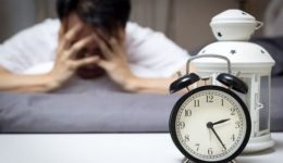 asian man in bed suffering insomnia and sleep disorder thinking about his problem at night