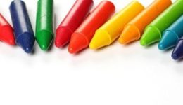 Oil pastel crayons lying on a paper