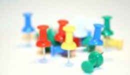 Image of thumbtacks for an article about guiding the reader through procurement and sourcing software.