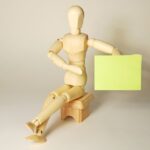 Image of a wooden man for an article about choosing the best RFP software.