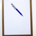 Image of a clipboard for an article about procurement manager responsibilities and tasks.