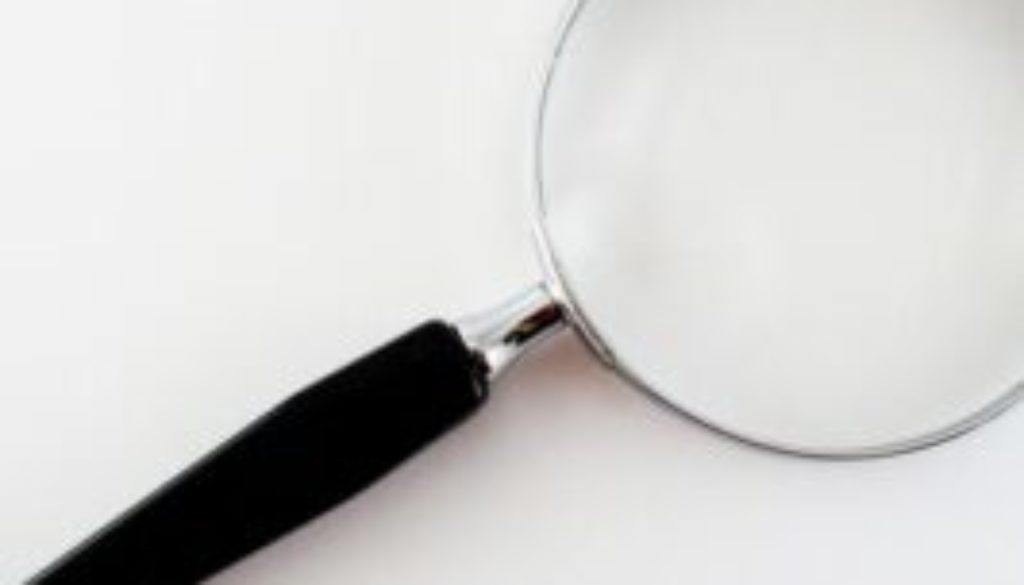 Image of a magnifying glass for an article about What to Look for in a Procurement Optimization Solution.