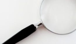 Image of a magnifying glass for an article about What to Look for in a Procurement Optimization Solution.