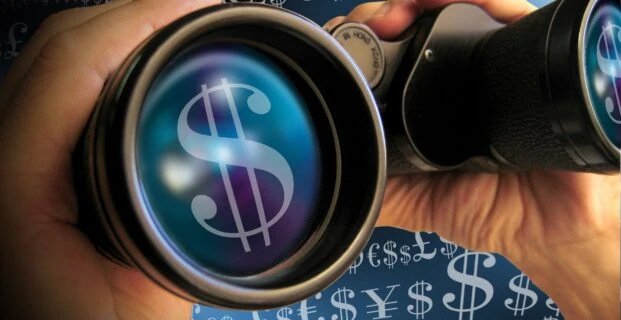 Image of binoculars looking through money for an article about Is Software Required to Manage Tail Spend.
