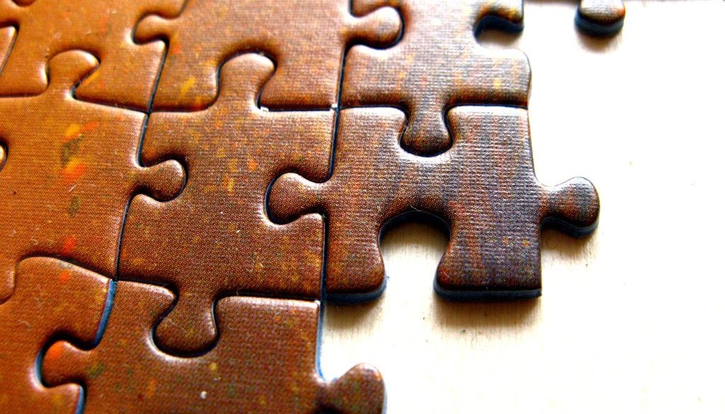 Image of puzzle pieces fitting together for an article about eSourcing Software: How to Get the Most from Your Solution