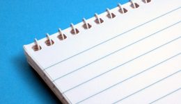 Image of a notepad on a blue background for an article about What are eSourcing Best Practices?.
