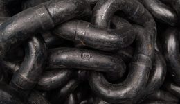 Image of a chain for an article about how supply chain management can mitigate the effect of inflation.